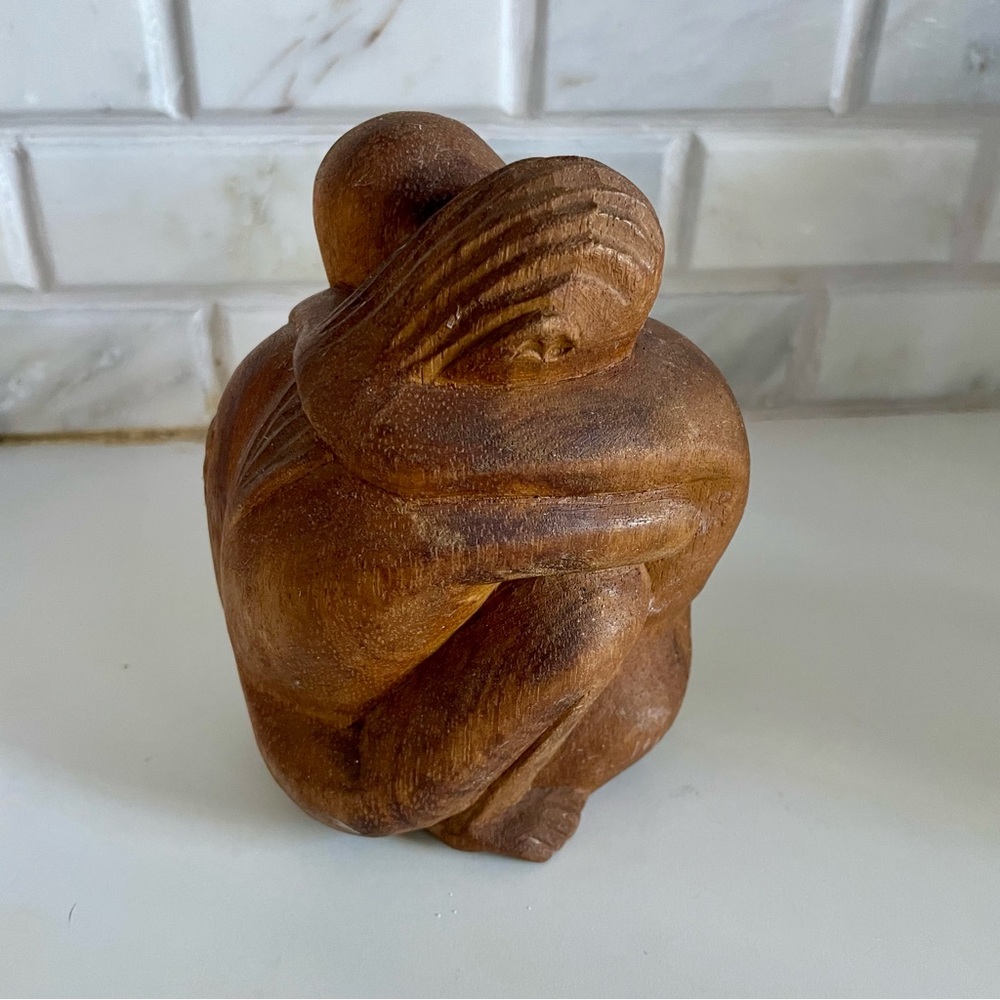 Lovers embrace wooden figurine